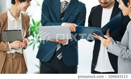 Group of business people having a conversation in the office Group of business people having a conversation in the office 100693515