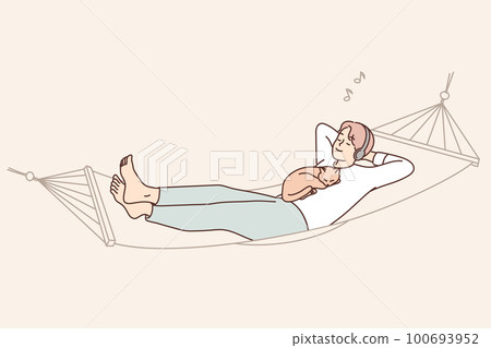 Guy lying with cat in hammock listen to music  100693952