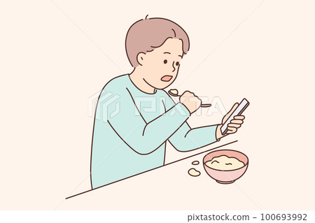 Child eat watching cartoons on cellphone Child eat watching cartoons on cellphone 100693992