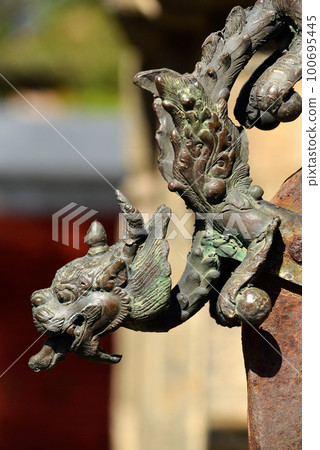 Brass sculpture of a dragon head. Pashupatinath, Nepal 100695445