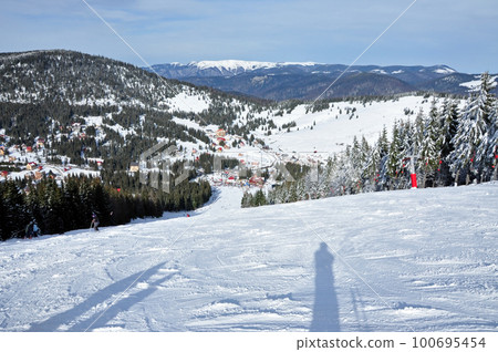 Ski resort in the mountains Ski resort in the mountains 100695454