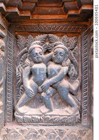 Erotic wooden carving motif on a Hindu temple in Nepal Erotic wooden carving motif on a Hindu temple in Nepal 100695481