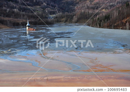 Abandoned church flooded by a lake full with chemical residuals. Geamana, Rosia Montana Abandoned church flooded by a lake full with chemical residuals. Geamana, Rosia Montana 100695483