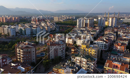Aerial view of modern residential buildings in european city. Townscape from drone. Aerial view of modern residential buildings in european city. Townscape from drone. 100698424
