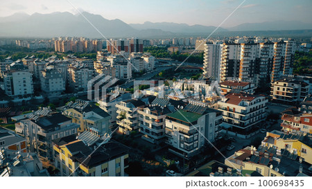 View of the city with modern houses. Aerial view from drone. Travel to Europe. View of the city with modern houses. Aerial view from drone. Travel to Europe. 100698435