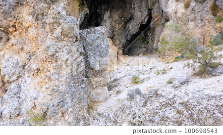 Cave in the rock. Different rocks are made by time. 100698543