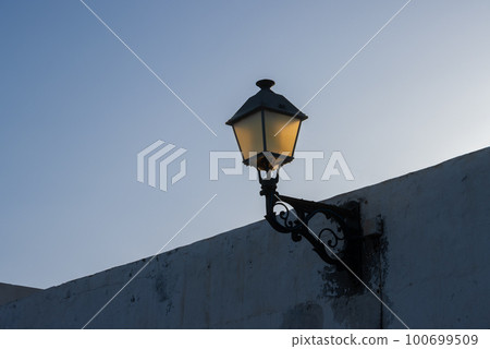 Street lantern during golden hour Street lantern during golden hour 100699509