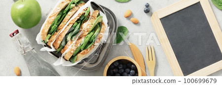 Empty chalk board and healthy sandwich flat lay Empty chalk board and healthy sandwich flat lay 100699679