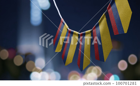 A garland of Colombia national flags on an abstract blurred background A garland of Colombia national flags on an abstract blurred background 100701281