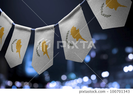 A garland of Cyprus national flags on an abstract blurred background 100701343