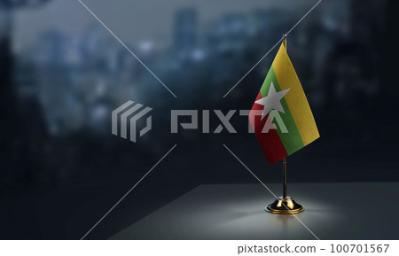 Small flags of the Myanmar on an abstract blurry background Small flags of the Myanmar on an abstract blurry background 100701567
