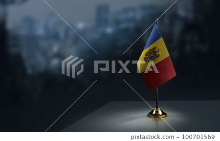 A small Moldavia flag on an abstract blurry background 100701569