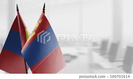 Small flags of the Mongolia on an abstract blurry background 100701614