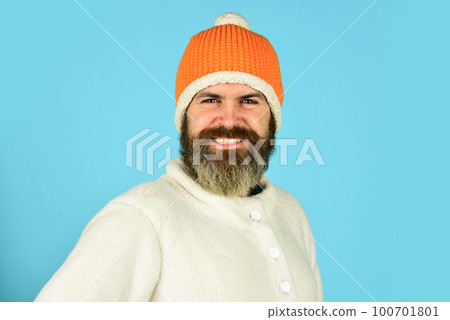 Holyday atmosphere. autumn weather forecast. knitwear hat protect from cold. bearded man wear winter hat. fashion clothes for cold weather. mature hipster blue background. male fashion style 100701801