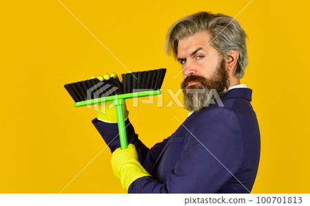 On guard of order. Cleaning day. Sweep in office. Hipster enjoy cleanliness. Cleaning business. Household duties. Cleaning service concept. Clear reputation. Bearded man formal suit hold broom brush 100701813