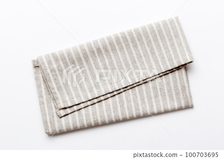 top view with gray kitchen napkin isolated on table background. Folded cloth for mockup with copy space, Flat lay. Minimal style 100703695