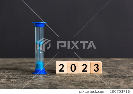 New Year 2023 sand timer. Resolution, time, plan, goal, motivation, reboot, countdown and New Year holiday concepts. Hourglass with number 2023 New Year 2023 sand timer. Resolution, time, plan, goal, motivation, reboot, countdown and New Year holiday concepts. Hourglass with number 2023 100703716
