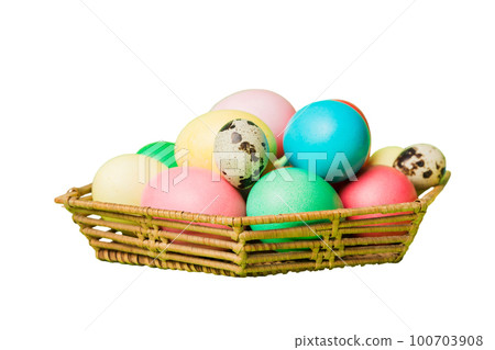 Basket of colorful Easter eggs isolated on white background. Easter basket filled with colored eggs top view holiday concept Basket of colorful Easter eggs isolated on white background. Easter basket filled with colored eggs top view holiday concept 100703908
