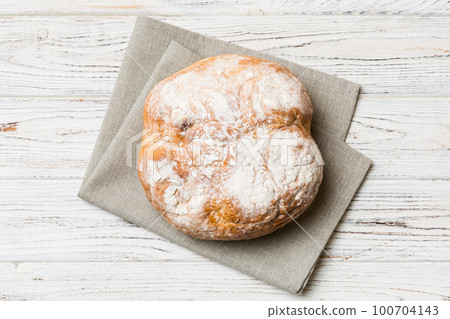 Fresh homemade crisp round bread on napkin, top view. Healthy unleavened bread. French bread. Top view Bakery products Fresh homemade crisp round bread on napkin, top view. Healthy unleavened bread. French bread. Top view Bakery products 100704143