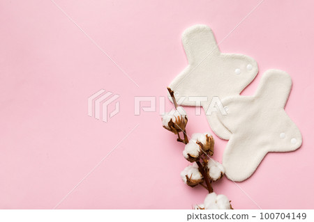 set of colorful bright reusable menstrual pads with cotton flower. zero waste woman periods concept top view with copy space 100704149