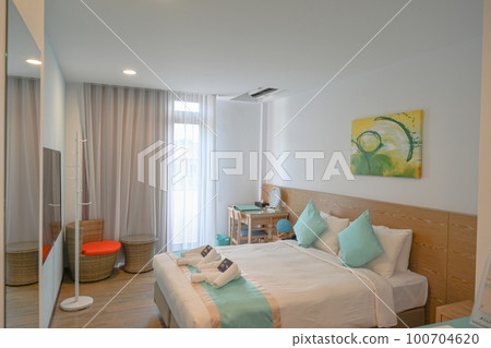 The interior of the hotel room, with white and Japanese green pillows on the floor The interior of the hotel room, with white and Japanese green pillows on the floor 100704620