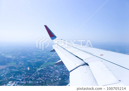 sky and wing of the plane or airplane window sky and wing of the plane or airplane window 100705214