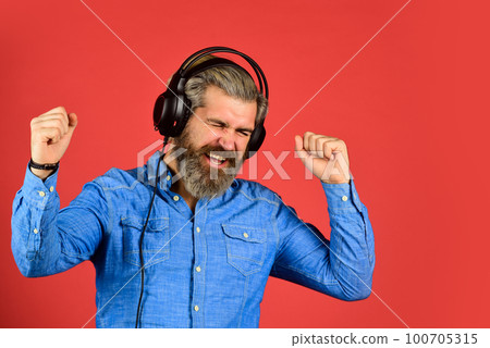 Music beat. Rhythm concept. Man bearded hipster headphones listening music. Hipster enjoy excellent sound song in earphones. Excellent music playlist. Noise cancellation function. Professional gadget Music beat. Rhythm concept. Man bearded hipster headphones listening music. Hipster enjoy excellent sound song in earphones. Excellent music playlist. Noise cancellation function. Professional gadget 100705315