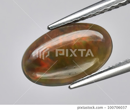 Natural gemstone opal on black background Natural gemstone opal on black background 100706037