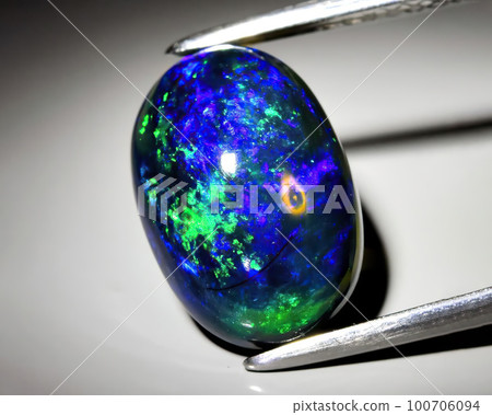 Natural gemstone opal on black background 100706094