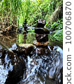 Balanced zen rock stacks in a creek. 100706870