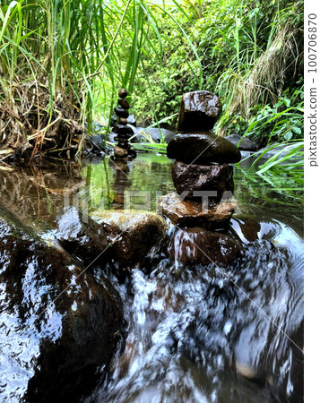 Balanced zen rock stacks in a creek. Balanced zen rock stacks in a creek. 100706870