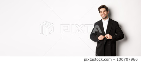 Image of handsome and confident businessman with beard, button down jacket and smiling, standing against white background 100707966