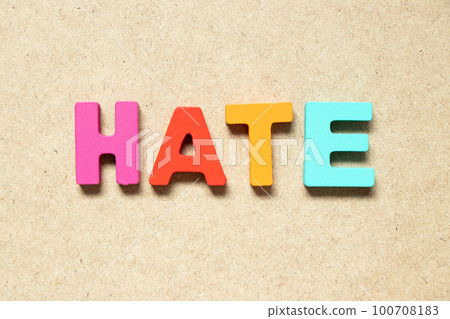 Color alphabet letter in word hate on wood background 100708183
