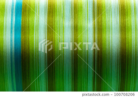 Closed up of green color of thread textured background (Focus at center of picture) Closed up of green color of thread textured background (Focus at center of picture) 100708206