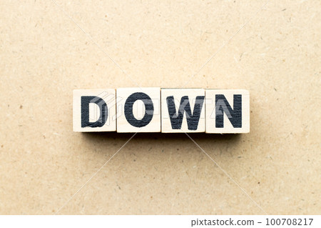 Alphabet letter block in word down on wood background Alphabet letter block in word down on wood background 100708217