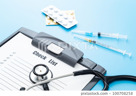 Stethoscope and check sheet blue back Stethoscope and check sheet blue back 100708258