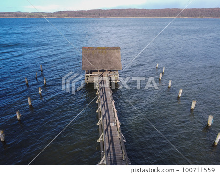 Daytime neutral density filter natural minimalist seascape pier. View of boats Daytime neutral density filter natural minimalist seascape pier. View of boats 100711559
