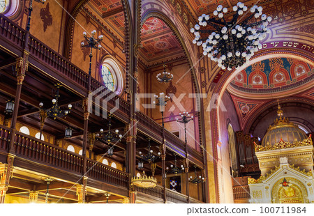Budapest, Hungary low angle interior view of illuminated Dohany Street Synagogue, Dohany utcai Zsinagoga. Budapest, Hungary low angle interior view of illuminated Dohany Street Synagogue, Dohany utcai Zsinagoga. 100711984