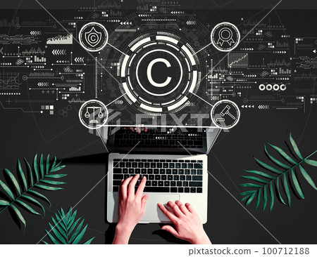 Copyright concept with person using a laptop 100712188