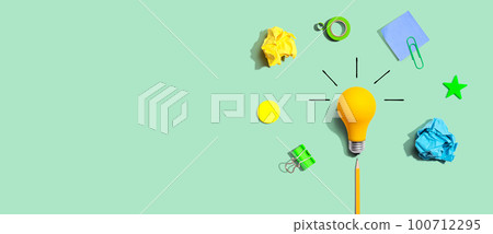 Brainstorming concept with a light bulb and school supplies - Flat lay Brainstorming concept with a light bulb and school supplies - Flat lay 100712295