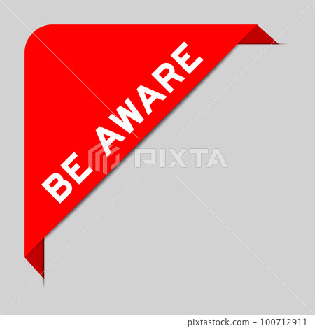 Red color of corner label banner with word be aware on gray background 100712911