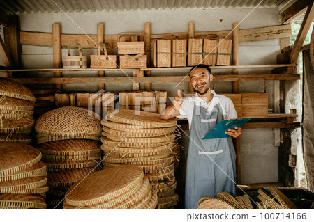 bamboo craft seller smiling to camera thumb up bamboo craft seller smiling to camera thumb up 100714166