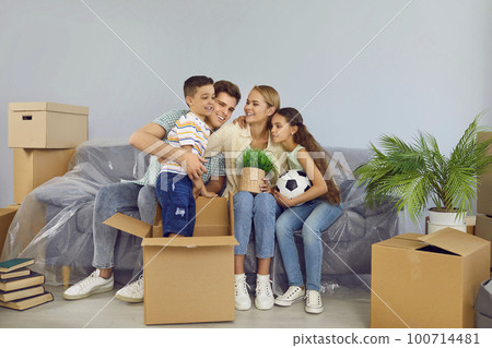 Happy friendly family with children are moving in new modern apartment house. Happy friendly family with children are moving in new modern apartment house. 100714481