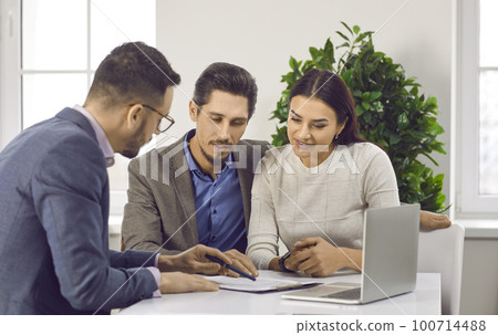 Real estate agent, lawyer or financial advisor consulting clients in office Real estate agent, lawyer or financial advisor consulting clients in office 100714488