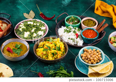 Assorted of traditional Indian food. 100715006