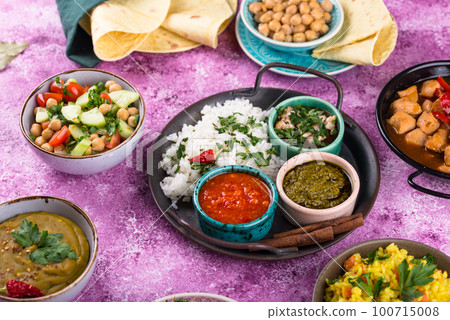 Assorted of traditional Indian food. 100715008