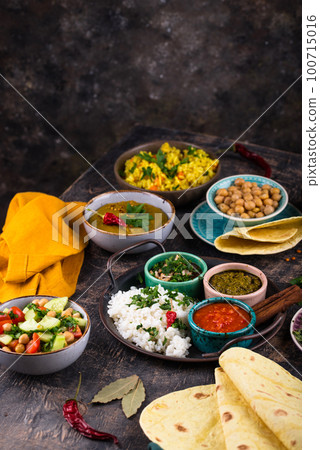 Assorted of traditional Indian food. 100715016