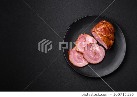 Delicious fresh baked meat roll with spices and herbs Delicious fresh baked meat roll with spices and herbs 100715156