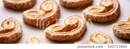 Homemade cottage cheese cookies in sugar glaze in form of heart 100715664