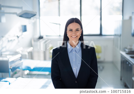 Portrait of young woman director in hospital room. Portrait of young woman director in hospital room. 100715816